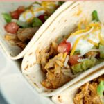 Crock-Pot Buffalo Chicken Tacos - Just 3 simple ingredients and you have the fixings for these Crock-Pot Buffalo Chicken Tacos! If you love buffalo chicken wings you will ADORE these tacos! [Healthy, Gluten Free, Low Calorie, Low Carb, Low Fat, Low Sugar & just 4 Weight Watchers SmartPoints per serving!] | CrockPotLadies.com